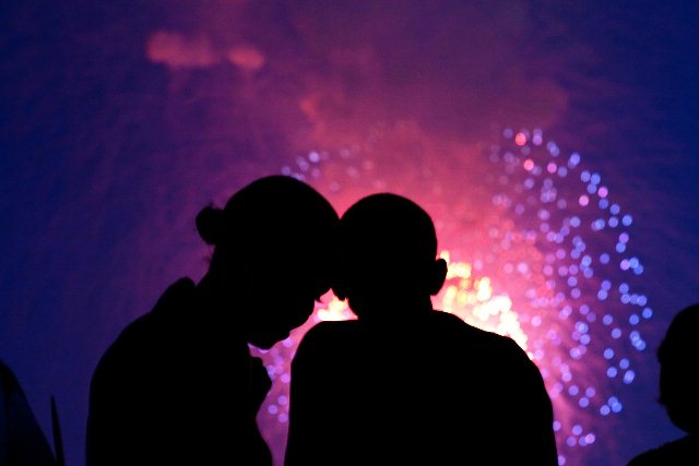 Barack Obama and Michelle Obama watch the fireworks over the National Mall from the roof of the White House, July 4, 2010.